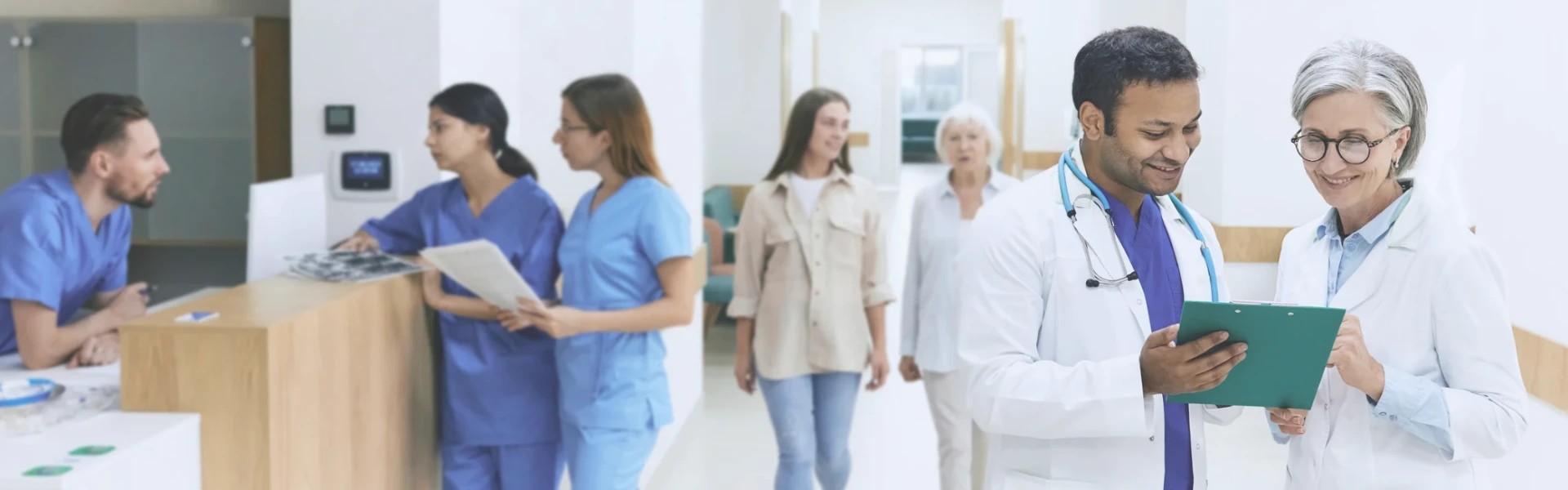 Faded cinematic view of a calm hospital reception lobby where care begins.